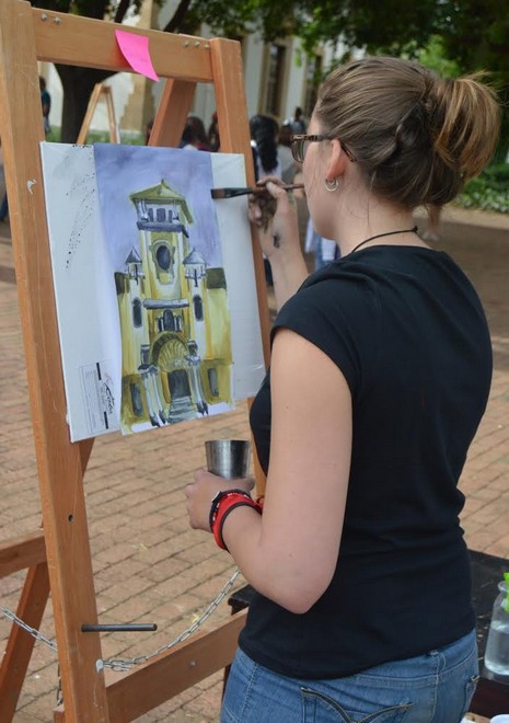 A Member of the South College putting some final touches to her painting.